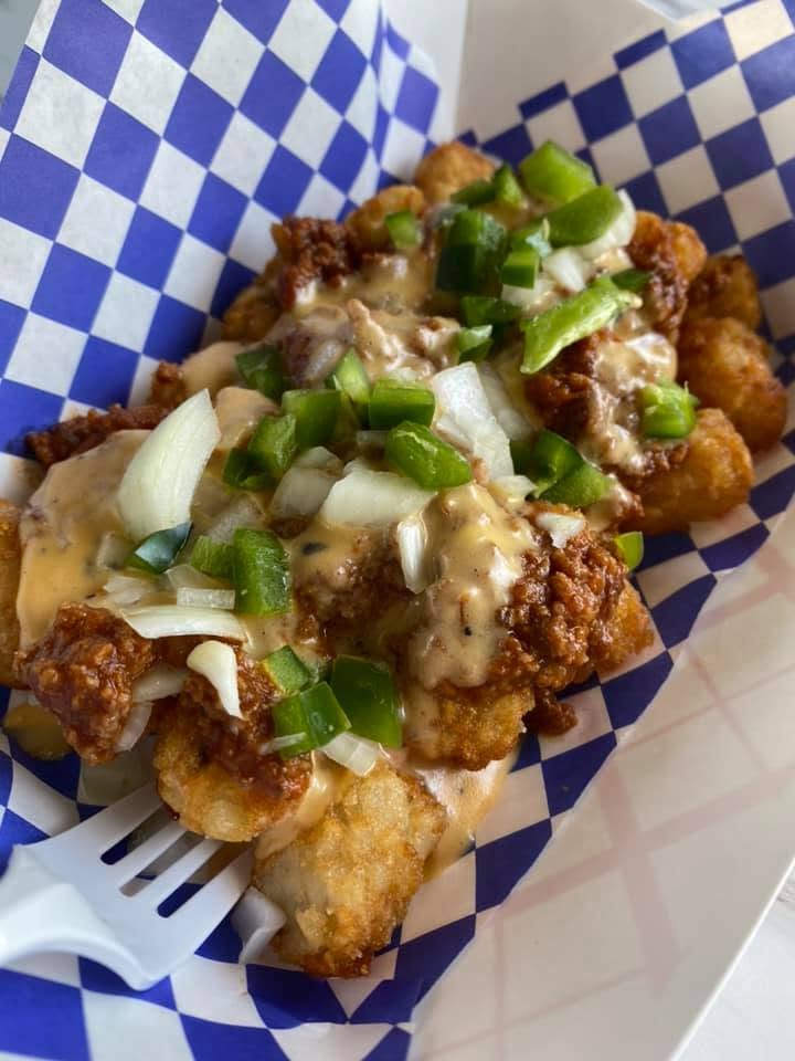 Fries loaded with cheese sauce and jalapeños