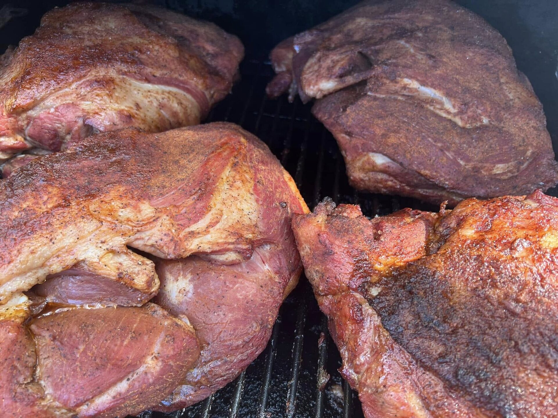Pork shoulders on the smoker out front
