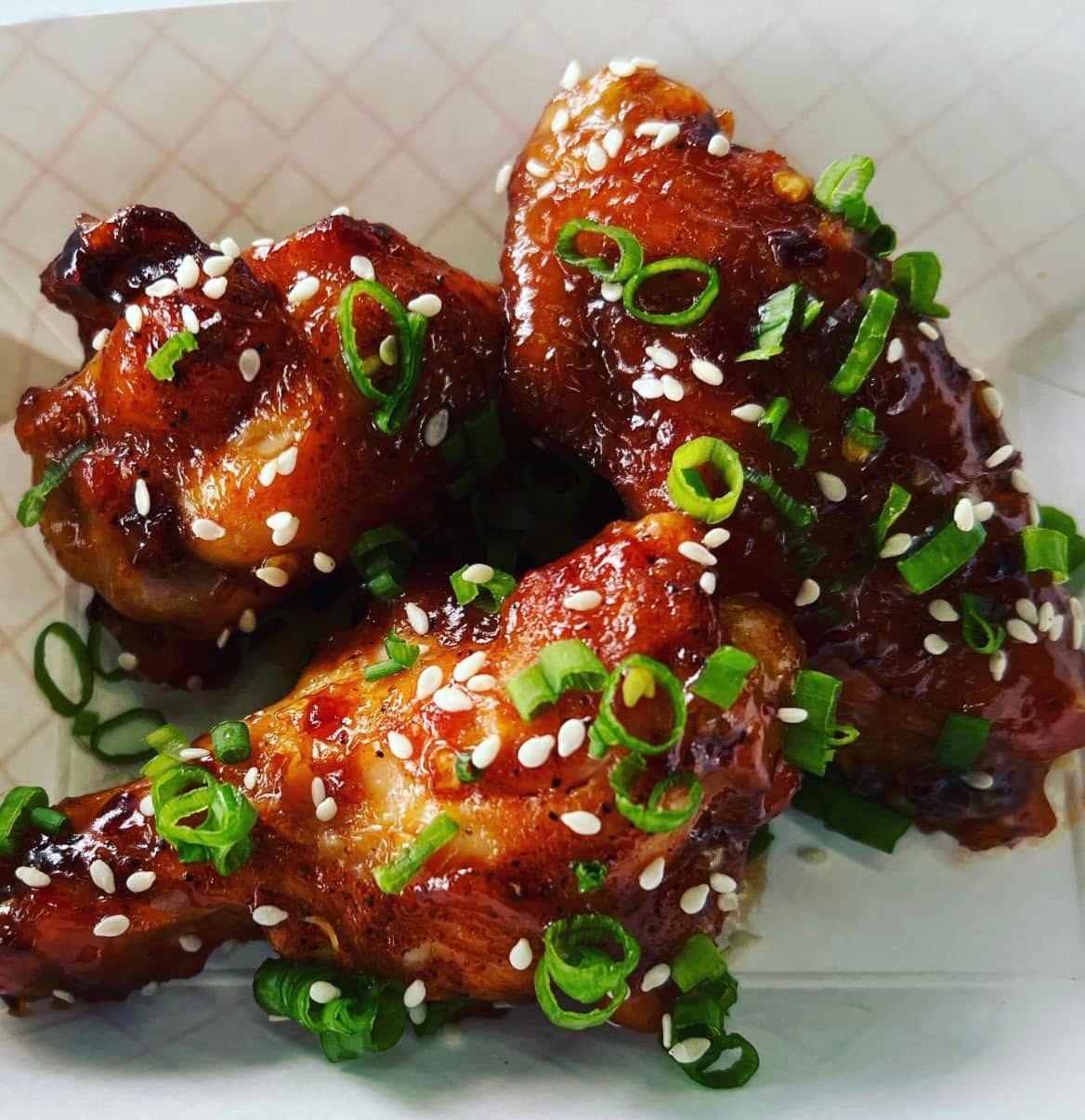 Sweet Thai chili wings with sesame and scallions