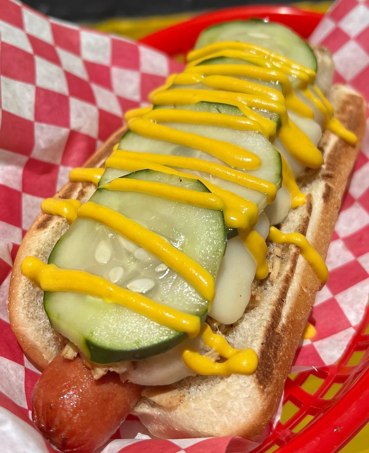 The Chicago Dog with pickle spears, tomato and mustard